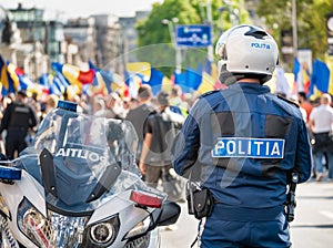 Traffic policeman on motorbike. Police officer control in the center of Bucharest