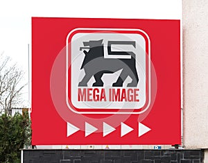 Logo of the Mega Image supermarket at the entrance of the store in Bucharest. Mega image is a part