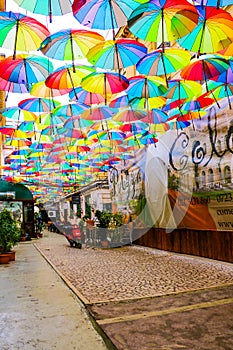 Bucharest, Romania, May 17, 2019: Cafe with colorful umbrellas on a street in Bucharest.