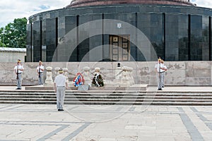 BUCHAREST, ROMANIA - MAY 14, 2017: Carol Park in Bucharest, Romania. Mausoleum and Changing Guard in Background.