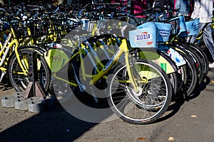 Bucharest, Romania, 1 November 2020: Many bicycles parked on a sidework in front of park in Bucharest, Romania, alternative