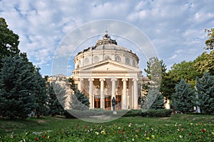 Bucharest Romanian Athenaeum (Ateneul Roman) domed, circular concert hall building at evening with clouds