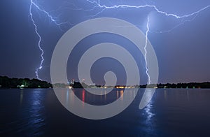 Lightning storm over the city in summer time Romania heavy rain