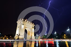 Bucharest Triumph Arch in the light storm by night