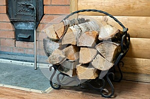 A bucket with a birch broom, a wood stove and other accessories for the sauna are in the steam room of the Russian bath