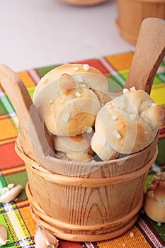 Bucket of buns with salt and garlic