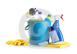 Bucket with cleaning supplies on white background