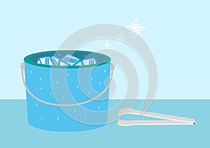 Bucket of Ice with snow symbols and tongs. Editable Clip Art. photo