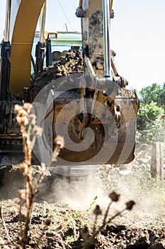 Bucket and mechanical arm of the excavator in motion