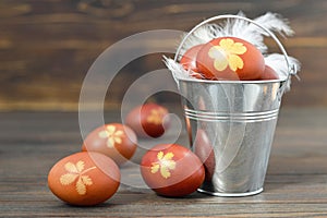 Bucket of naturally colored Easter eggs