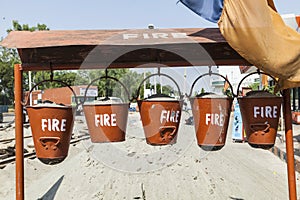 Bucket with sand in a petrol station for fire fighting