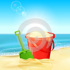 Bucket of sand and shovel on beach