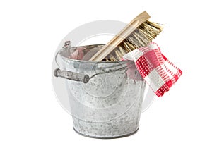 Bucket with scrubbing brush and tea towel