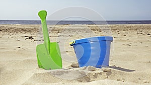 Bucket and shovel on the beach