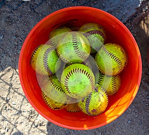A bucket of softballs