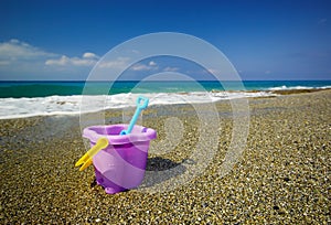 Bucket and spade on the beach sand