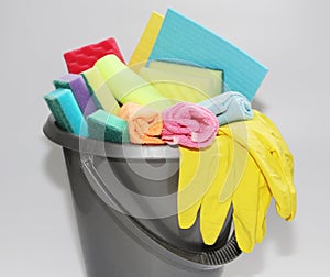 Bucket with tools for cleaning an apartment or office. No one in the photo