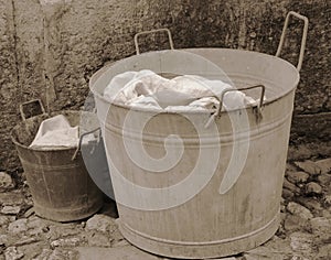 bucket and tub for doing the laundry with sepia effect from the 1920s