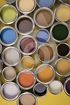 Buckets full of rainbow colored oil paint