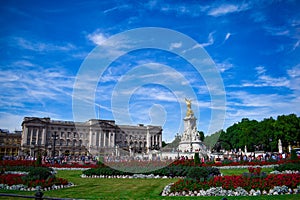 Buckingham Palace with Monument. Full view of Buckingham Palace during sunrise.Buckingham palace and the Victoria memorial with a
