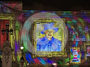 Buckingham Palace projection of Queen's portrait a