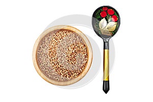 Buckwheat in bowl and russian hand pained spoon isolated