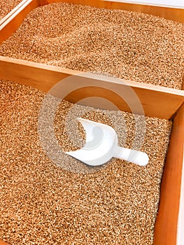 Buckwheat in boxes on the counter in the supermarket. food background