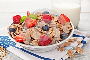 Buckwheat flakes with fresh mix fruit and milk.