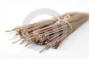 Buckwheat noodles closeup. Raw food ingredient. Dried buckwheat soba noodles. Traditional Japanese food