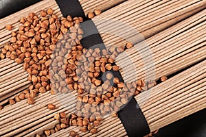 Buckwheat noodles closeup. Raw food ingredient. Dried buckwheat soba noodles. Traditional Japanese food - Image