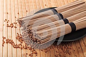 Buckwheat noodles closeup. Raw food ingredient. Dried buckwheat soba noodles. Traditional Japanese food - Image