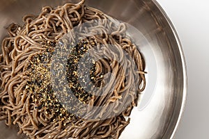 Buckwheat noodles in perilla oil on a white background