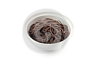 Buckwheat noodles on white background