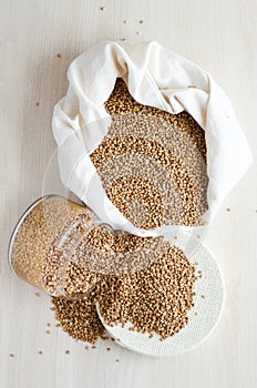 Buckwheat porridge in glass jar and canvas bag