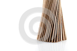 Buckwheat soba noodles in bunche, isolated on white background. Close-up.