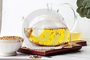 Buckwheat soba tea Japanese drink in a glass teapot