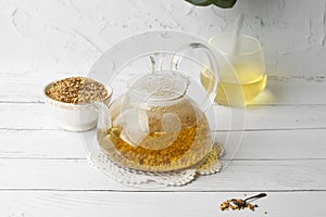 Buckwheat soba tea Japanese drink in a glass teapot