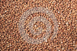 Buckwheat. Top view. Food Background. A scattering of buckweat grains. Healthy food. photo