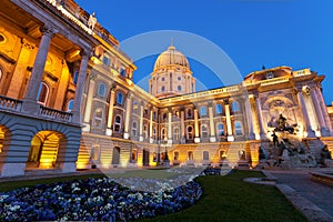 The Buda Castle in Budapest with a flower bed photo