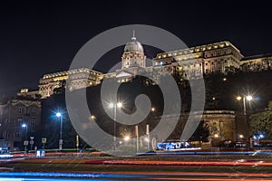 Buda Castle by the Danube river illuminated at night in Budapest, Hungary