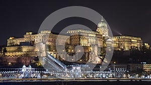 Buda Castle by the Danube river illuminated at night in Budapest, Hungary