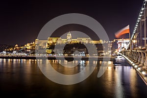 Buda Castle, Royal Palace by the Danube river illuminated at night in Budapest
