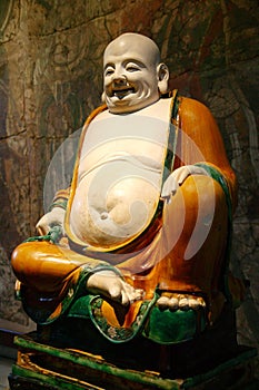 Budai a fat smiling Buddha monk photo