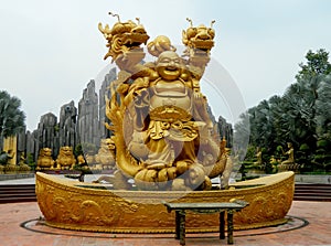 Budai golden sculpture photo