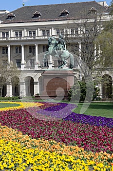 Budapest, colorful flowerbed and equestrian statue