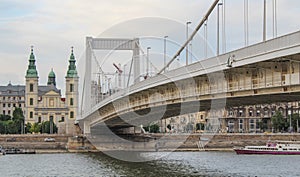 The Budapest Elisabeth bridge on the Danube river with the Inner-City Mother Church in the background