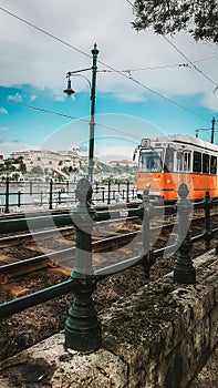 Budapest / Hungary - 2019. Typical European orange tram in Budapest. Public transportation in Hungary. Front view of a moving