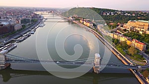 Budapest, Hungary - 4K aerial skyline view of the famous Szechenyi Chain Bridge over River Danube at sunrise