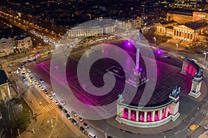 Budapest, Hungary - Aerial drone view of the famous Heroes` Square Hosok tere lit up in unique purple and pink color photo