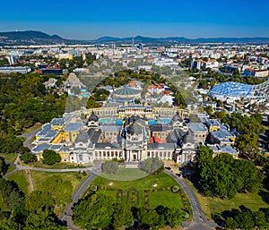 Budapest, Hungary - Aerial panoramic drone view of the famous Szechenyi Thermal Bath in City Park Varosliget with Budapest Zoo